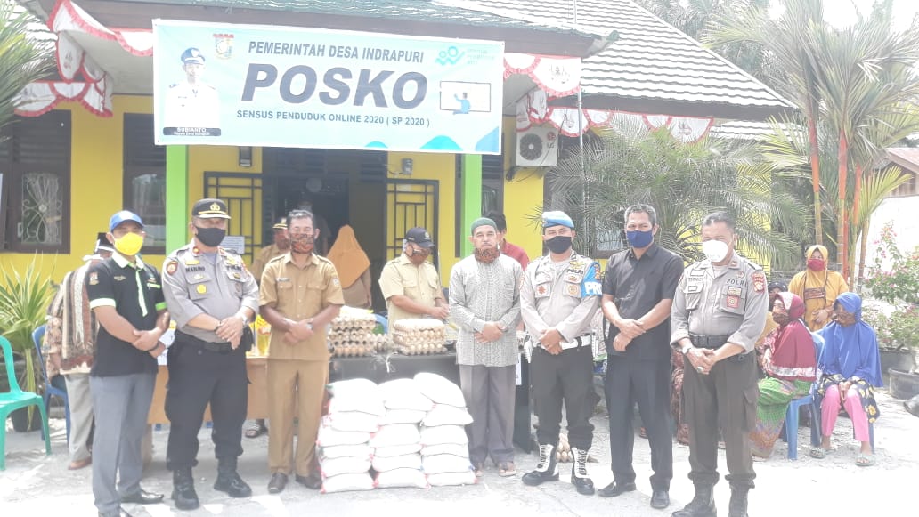 20 Paket Sembako Dari Bhayangkari Ranting Tapung Didistribusikan kepada Warga Kurang Mampu